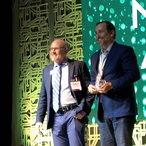 Ndustrial Founder & CEO Jason Massey accepting the 2023 NC Clean Tech Company of the Year Award from the NC TECH Association.